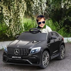 Coche eléctrico infantil Mercedes AMG Homcom con música + luces negro 55x115x70 cm