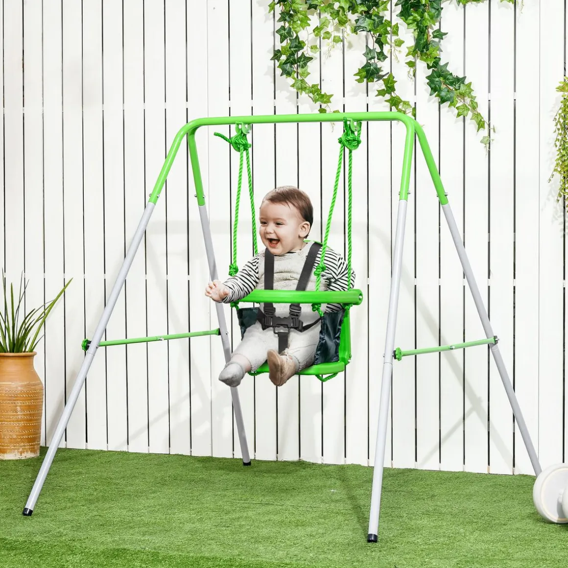 Columpio infantil Huelva Outsunny 6-36M protección 360º verde 122x122x146 cm